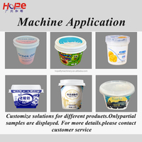 Machine de remplissage, scellage et bouchage rotative à double tête pour yaourt, crème, sauce, confiture et liquides