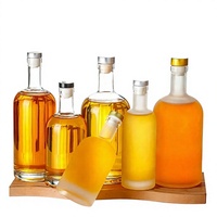 Botol Minuman Keras Kaca Buram Bulat Custom 100ml-1000ml dengan Tutup untuk Kemasan Vodka Whisky Brandy Cina
