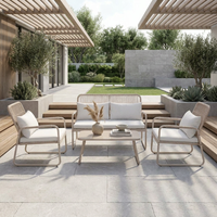 Ensemble de salon de jardin en rotin 4 pièces avec structure en acier thermolaqué et assise en osier tressé pour l'extérieur