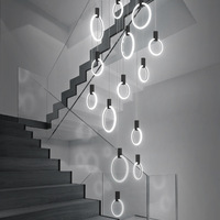 Lustre suspendu moderne créatif pour escalier et salon, design long et rotatif, style duplex
