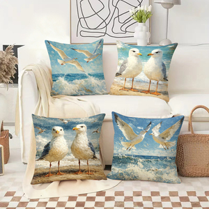 Des coussins décoratifs sur le thème des mouettes ornent un canapé confortable avec des chaussettes de Noël festives en arrière-plan. - Product Image 2