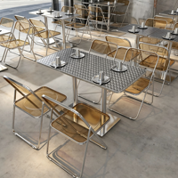 Ensemble de salle à manger de style industriel avec table carrée en acier inoxydable embossé + chaise pliante transparente ambrée