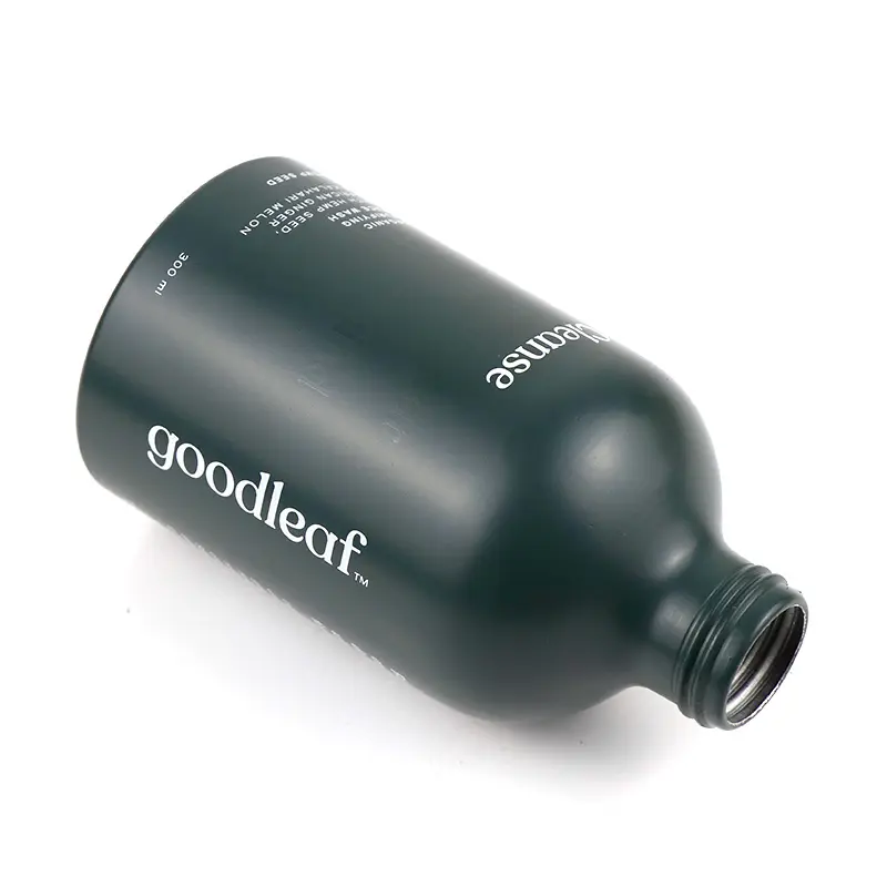 Bouteille de pompe en aluminium vert mat de nouvelle technologie pour le nettoyant de gel de shampoing cosmétique