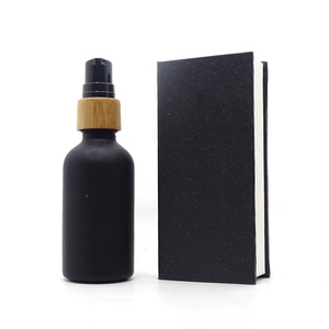 cosmetic essential oil packaging 30ml beard oil boston bottle 1oz matte black essential oil glass dropper bottle with paper box