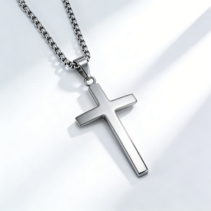 This unisex <b>titanium</b> steel cross necklace features a unique geometric design and a colorfast cross pendant. - Product Image 1