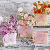 Boîte cadeau florale de luxe faite à la main, portable et pliable, avec motif floral et estampage sur papier couché pour le transport des fleurs