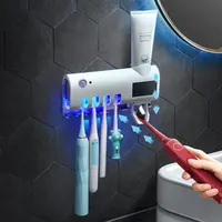 Настенный держатель с УФ-стерилизатором и автоматическим дозатором зубной пасты