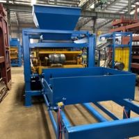 Machine à fabriquer des briques en ciment contrôlée par PLC QT8-15 avec vibration hydraulique pour une production stable de blocs de béton