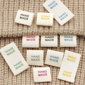 Etiquetas de nombre personalizadas, etiquetas de talla cosidas, etiquetas de marca tejidas, etiquetas lavables para ropa y calzado, hechas de tela de algodón. - Product Image 1