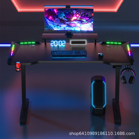 Prix de gros Table de bureau de jeu réglable en hauteur lumière LED RVB de levage électrique Table d'ordinateur PC noire