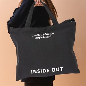 Sac fourre-tout en toile de coton noir avec bandoulière amovible et impression de slogan pour femme, idéal pour le quotidien et le shopping décontracté - Product Image 1