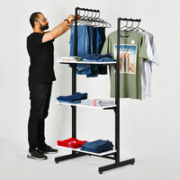 Étagère de magasin de vêtements de boutique Mingtang personnalisée, présentoir de vêtements en métal, présentoir de t-shirts pop-up pour boutique de vêtements