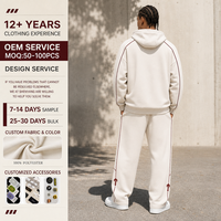 Ensemble de survêtement d'hiver 2 pièces respirant pour homme, sweat à capuche uni et pantalon de jogging ample à jambes larges avec passepoil contrastant, tenue streetwear décontractée, personnalisable OEM