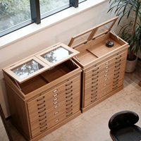 Vitrine à lunettes vintage en bois massif avec plusieurs tiroirs, éclairage LED, design écologique |   Vitrine équipée d'un miroir rabattable
