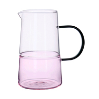 Ensemble de carafes en verre superposées bicolores avec poignée noire, idéal pour l'eau froide, les jus et le thé glacé