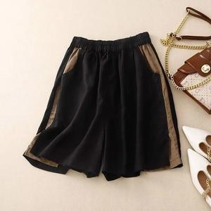 กางเกงขาสั้นผู้หญิงผ้าลินินสีส้มเอวสูงยืดลำลองสีพื้นกางเกงขาสั้นขากว้างทรงหลวมเสื้อผ้าแฟชั่น2025ฤดูร้อน - Product Image 3