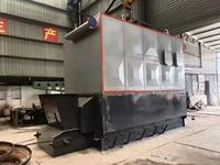 Chauffe-huile thermique horizontal à biomasse de 0,7 à 5,6 MW, à grille à chaînes, alimenté à la copeaux de bois, haute température
