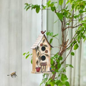 Antiek, verweerde metalen vogelhuisjes voor buiten, handgemaakt tuindecoratie met dubbele opening en bloemmotieven. - Product Image 5