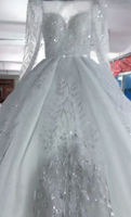 Robe de mariée de luxe 2026 entièrement ornée de cristaux, style robe de bal, manches longues transparentes, col rond illusion, grande taille, style africain, Vestido De Novia