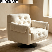 Fauteuil pivotant de luxe en cuir mélangé, rembourré de plumes, avec base pivotante en carbone noir mat