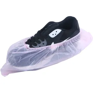 Venta al por mayor de fábrica, cubierta de zapato de lluvia a prueba de agua biodegradable y desechable PE rosa para impermeable