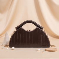 Nouveaux sacs à main pour femmes, sacs rigides à motif rayé, sacs messager personnalisés de couleurs unies, sacs à bandoulière et sacs traversins en gros d'usine