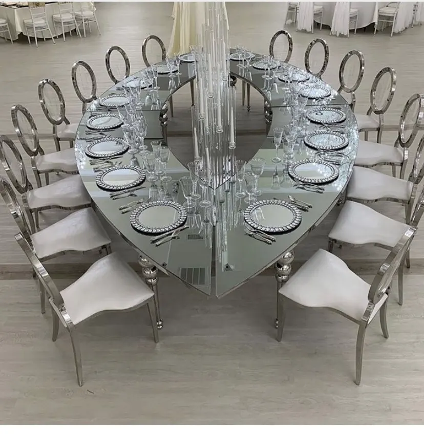 Conjunto de mesas y sillas de comedor de boda con tapa de cristal y marco de acero inoxidable ovalado