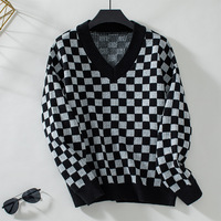 Maglione con motivo a scacchiera invernale all'ingrosso con scollo a V a tracolla manica lunga Pullover larghi a coste in maglia a quadri maglioni da donna