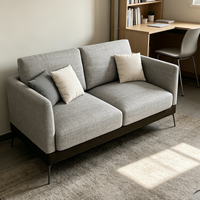 Ensemble de canapés d'angle modernes et élégants pour salon d'appartement, forme rectangulaire avec revêtement gris élégant et pieds en métal