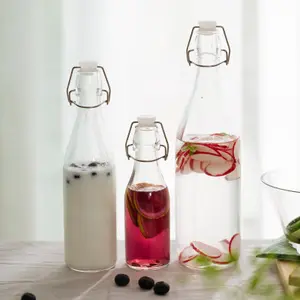 2022 wholesale 250ml 500ml 1000ml 1L round and square glass swing top drinking bottles with flip top sealing lids