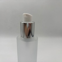 Haute qualité 60ml huile essentielle bouteille en verre forme ronde et 18/410 argent cosmétique Lotion traitement crème pompe