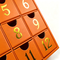 Boîte de calendrier de l'avent de Noël haut de gamme en forme de livre, boîte à bijoux avec 12 tiroirs, impression de numéros en feuille d'or, boîte cadeau en papier rigide