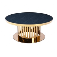 Table basse élégante en acier inoxydable avec pied rond et miroir doré