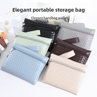 Pochette populaire pour femme en cuir PU à texture tissée, avec fermeture éclair, pour maquillage et mini porte-monnaie, idéale pour les voyages quotidiens