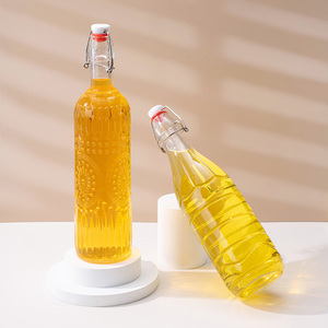 Bouteilles en verre personnalisées avec bouchon à bascule, 1000 ml, rondes, transparentes, réutilisables, pour jus, soda, kombucha, avec couvercle - Product Image 1