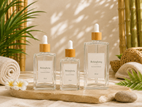 L'usine BoFangHong personnalise des flacons compte-gouttes en verre transparent de forme carrée plate de 30, 50 et 100 ml pour huiles essentielles et parfums, avec embout doré.