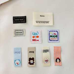 Etiquette en coton pour l'entretien des vêtements avec logo personnalisé Etiquettes de vêtement à pli central organique de police - Product Image 3