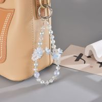Chaîne de téléphone portable faite à la main, perles, fleurs plaquées, perles douces, anti-perte, style INS, breloque de sac, pendentif