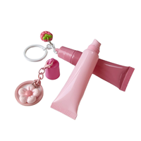 Personnalisable 15g Lip Gloss Tube Squeeze Tube rose avec porte-clés mignon Crème pour les mains, crème pour les yeux et fond de teint Contenant liquide