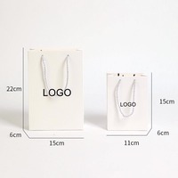 Sacs en papier de luxe faits à la main avec poignée pour emballage de bijoux, personnalisables avec logo, pour colliers et bagues