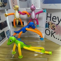Jouet de soulagement du stress en plastique à ventouse, tube télescopique polyvalent, dinosaure de dessin animé, nouveauté