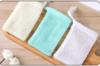 Vente en gros pochette de sac à savon en nylon filet africain personnalisé Ghana sac de douche exfoliant de bain en éponge avec cordon ruban