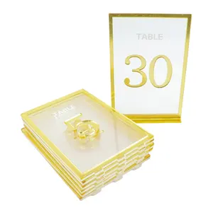 MOQ BAJO Cortado con láser Bordes dorados Marcos de acrílico Número de mesa con soportes dorados para centros de mesa de boda Decoración de mesa