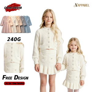 Conjunto de punto esponjoso a juego para hermanas de A&J Garment Factory: Cárdigan corto y falda con volantes, botones de diamantes de imitación, color marfil, estilo coquette para niñas 2026 - Product Image 1