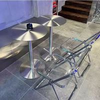 Table haute ronde moderne Dareko en acier inoxydable pour événements, hôtels, îlots de cuisine, salons, cafés