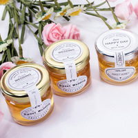 Vente en gros Cadeau forme ronde clair mini abeille pot en verre 30ml petits contenants avec couvercles dorés