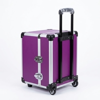 Valise à outils en aluminium violet à roulettes avec fermoirs verrouillables pour les voyages et le travail mobile