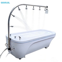 Lit de massage à jets d'eau d'hydrothérapie moderne, nouveau, sortie d'usine, table en acrylique, acier inoxydable, douche Vichy pour spa, salle de sport, bien-être