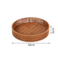 Panier de rangement rond tissé en rotin Plateau de nourriture domestique Panier en rotin multi-modèle personnalisé