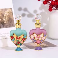 Flacon vide en verre pour huiles essentielles et parfums de voyage, en forme de cœur, avec texture givrée, motif papillon et fleur émaillés